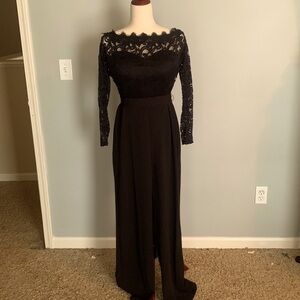 long sleeved black jumpsuit with a tie belt